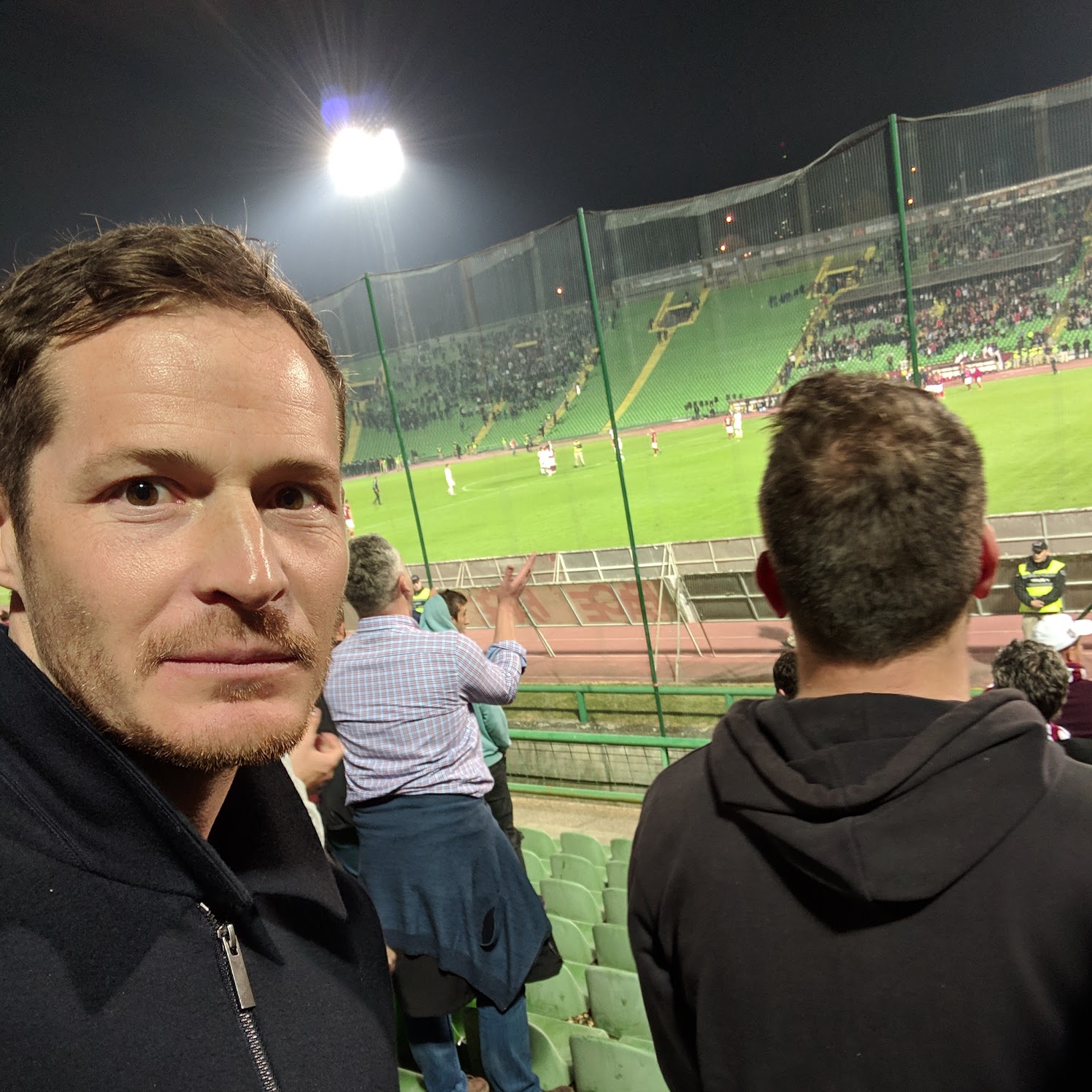 James at a floodlit match in Eastern Europe