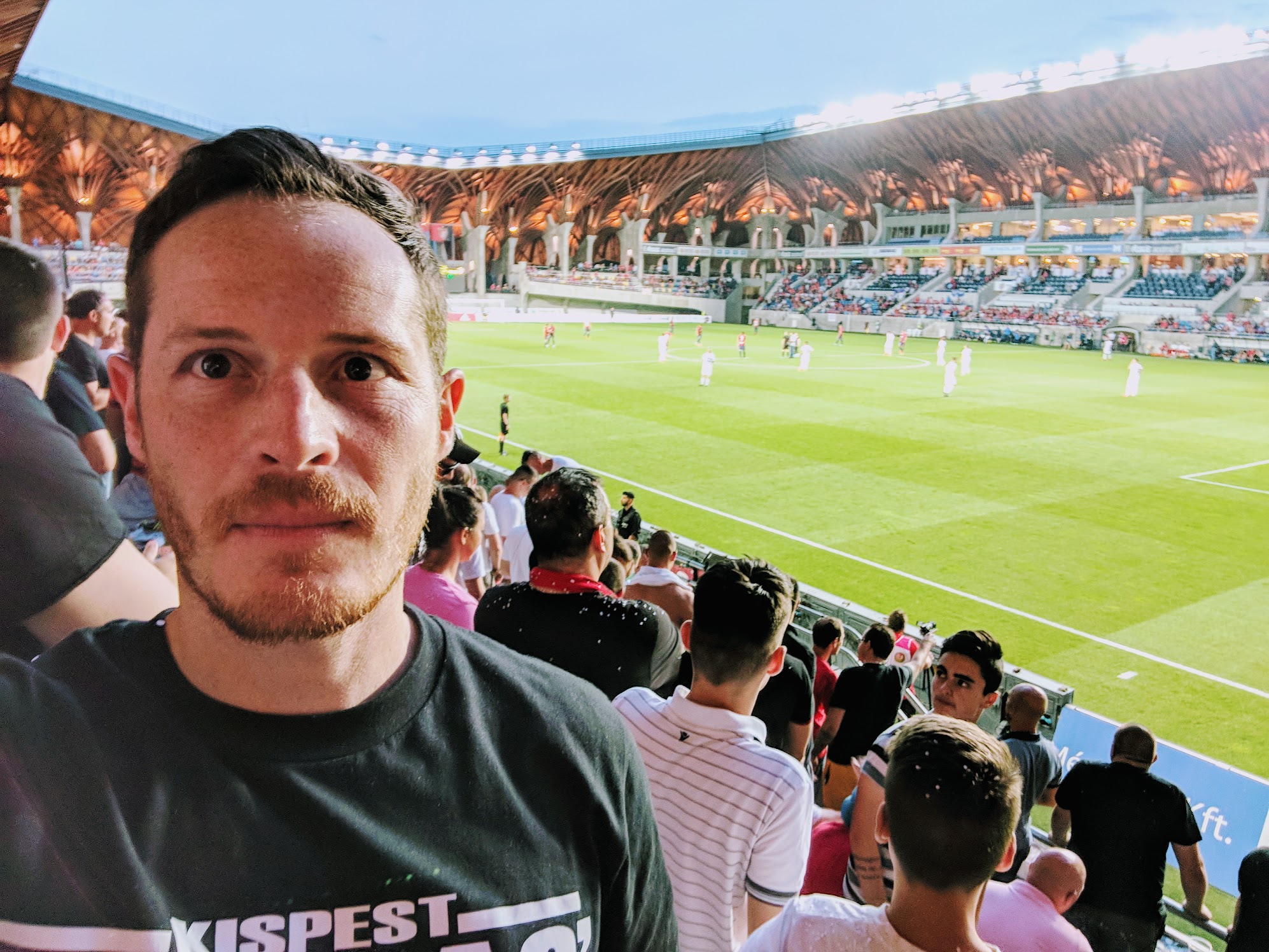 James at a match in a striking modern stadium